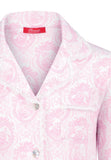 Elegant pink toile girls’ pajamas made from soft cotton with lace edges and pearl buttons. Comfortable, breathable, and perfect for sleeping or relaxing at home.